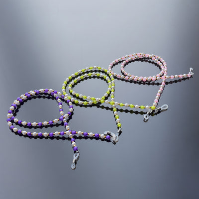 A chain for glasses, beads, an orange pendant — Hurtel